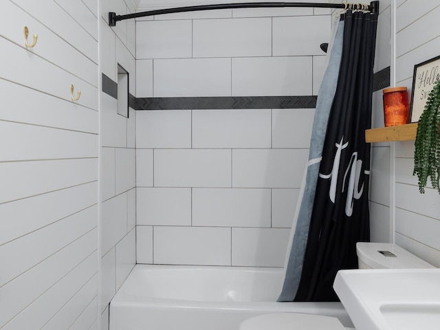 bathroom with shower / tub combo and toilet