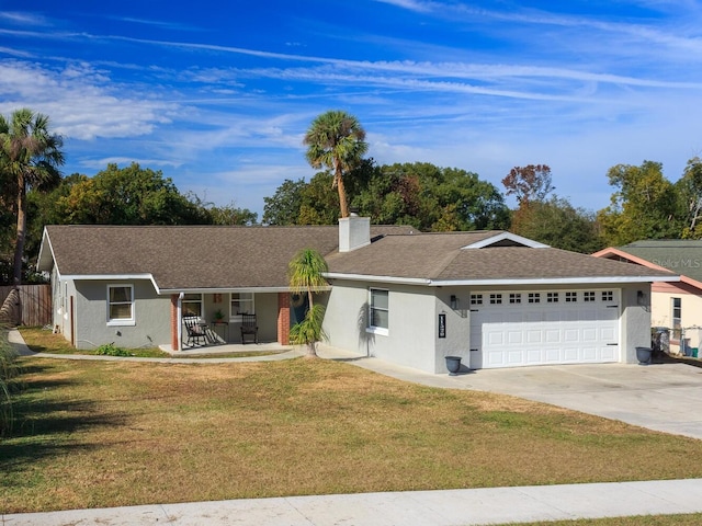 ranch-style house with a porch, a front yard, and a garage