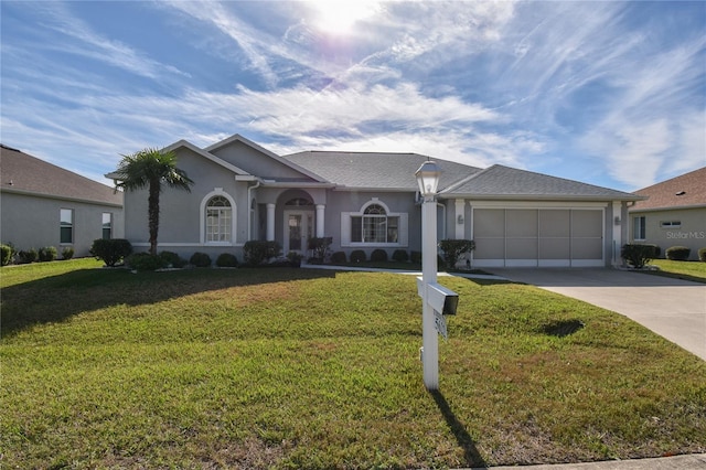 single story home featuring a front yard and a garage