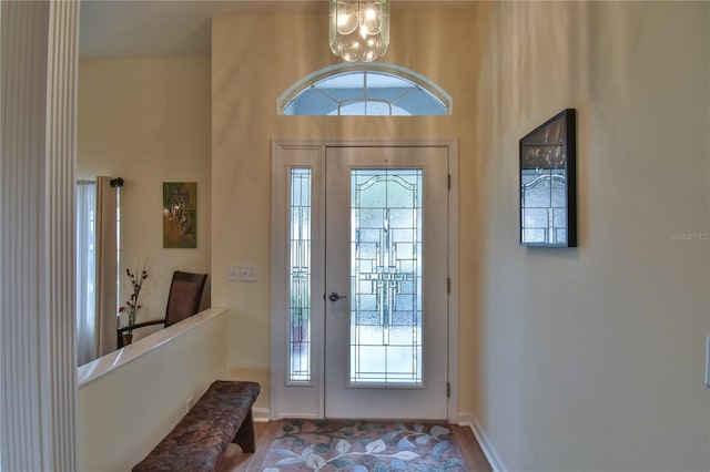 entrance foyer with plenty of natural light and a notable chandelier