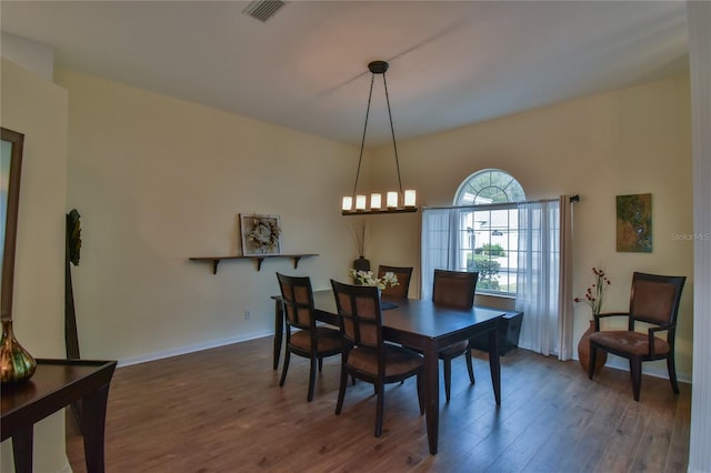 dining space featuring dark hardwood / wood-style flooring