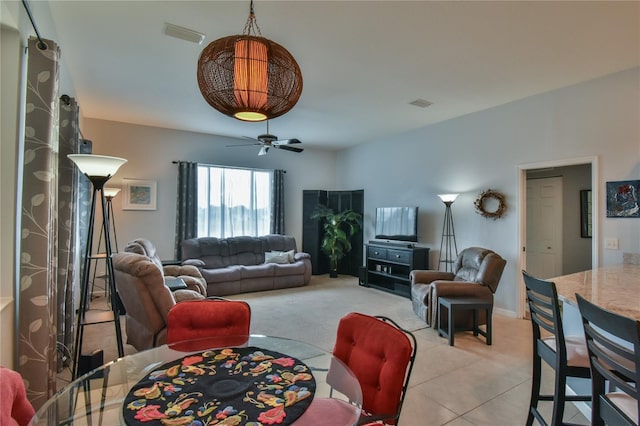 living room with light colored carpet and ceiling fan