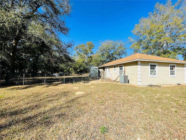 view of yard featuring central AC unit