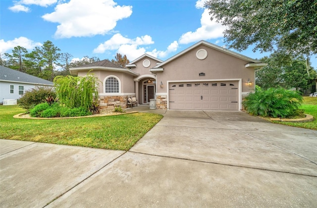 view of front facade featuring a garage and a front lawn