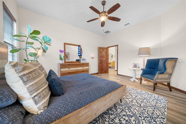 bedroom featuring hardwood / wood-style flooring and ceiling fan