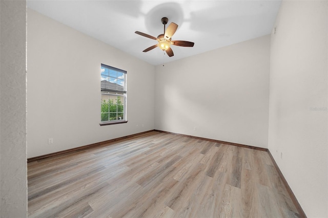 unfurnished room featuring ceiling fan and light wood-type flooring