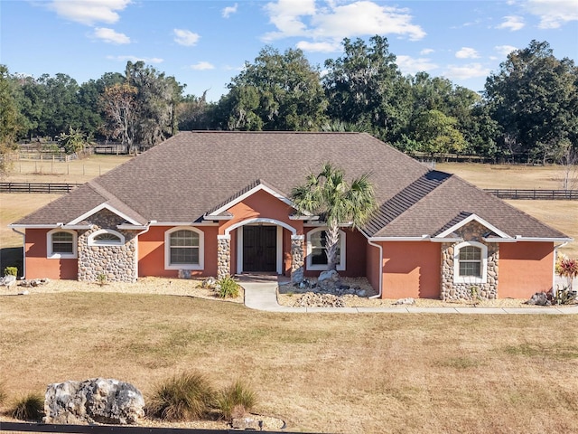 ranch-style house with a front yard