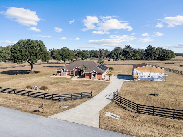 birds eye view of property featuring a rural view