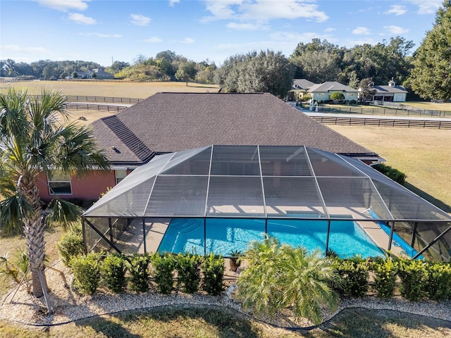 view of swimming pool with a lanai