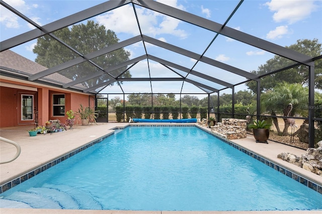 view of pool featuring a lanai and a patio area