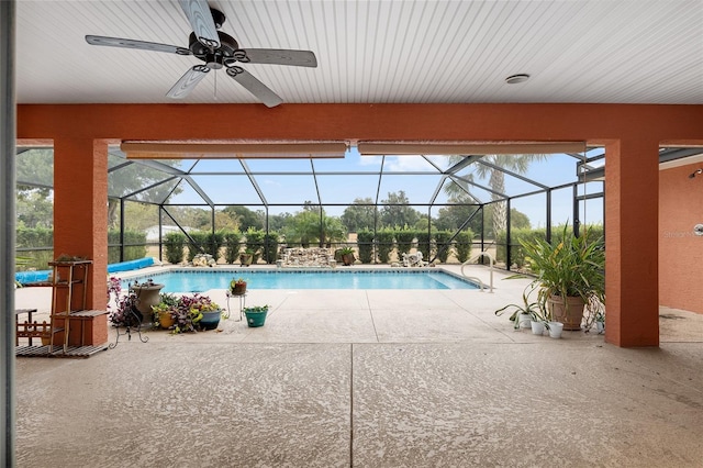 view of pool with a patio area, ceiling fan, and a lanai