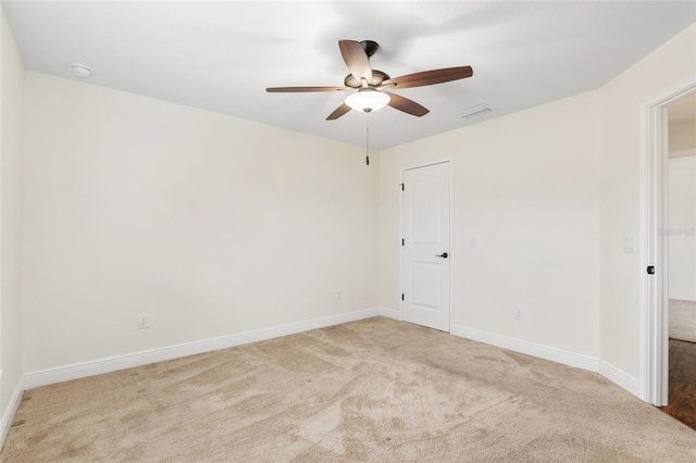 carpeted empty room with ceiling fan