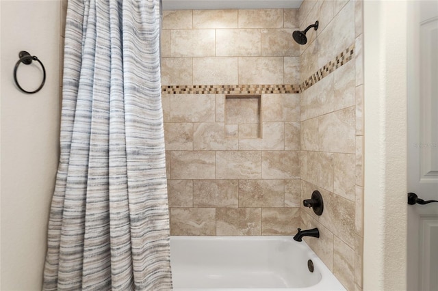 bathroom with shower / bath combo