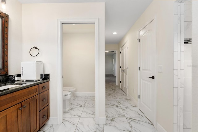 bathroom with vanity and toilet