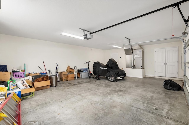 garage with a garage door opener and heating unit