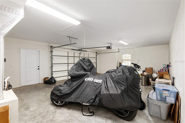 garage featuring a garage door opener