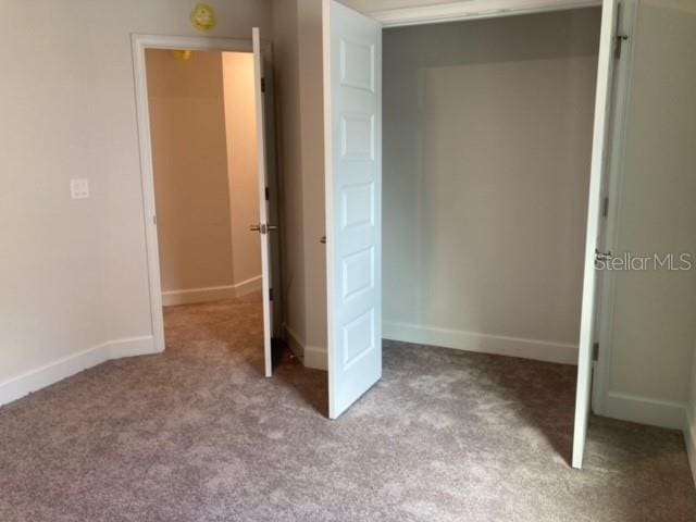 unfurnished bedroom with light carpet