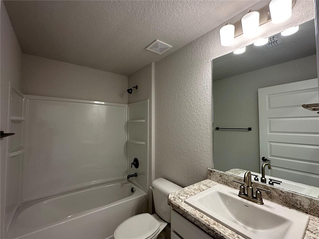 full bathroom featuring vanity, shower / tub combination, a textured ceiling, and toilet