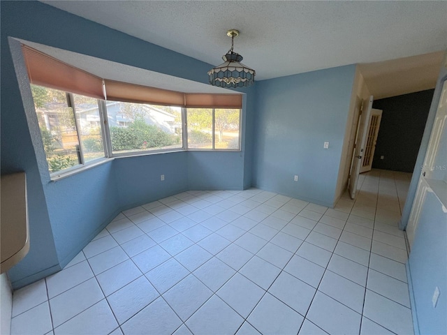 empty room featuring light tile patterned floors