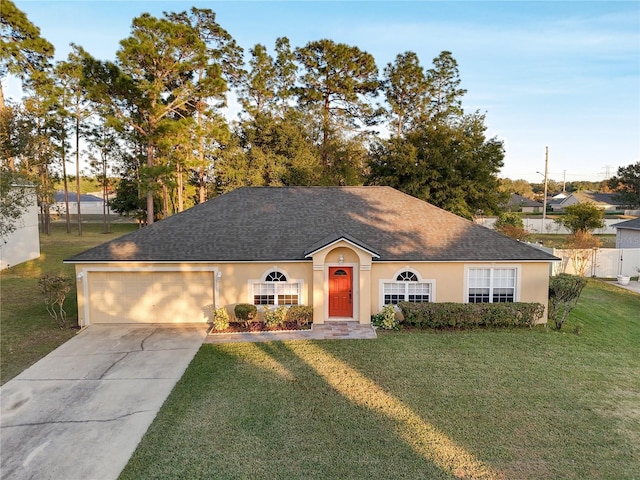 single story home featuring a front yard and a garage