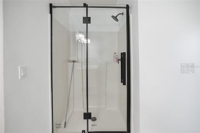 bathroom featuring an enclosed shower