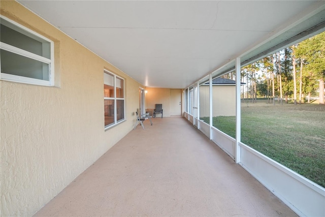 unfurnished sunroom featuring a wealth of natural light