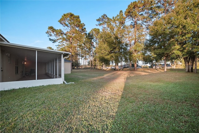 view of yard with a sunroom