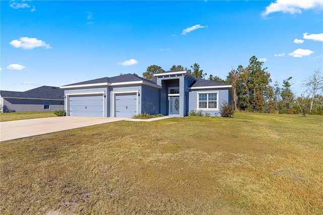 view of front facade featuring a garage and a front lawn