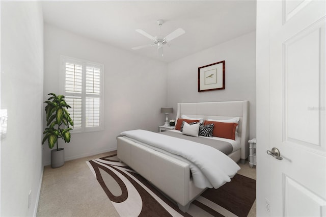 bedroom with light carpet and ceiling fan