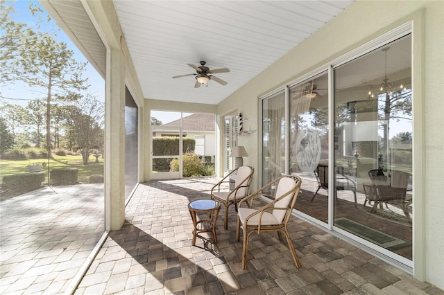 sunroom / solarium with ceiling fan