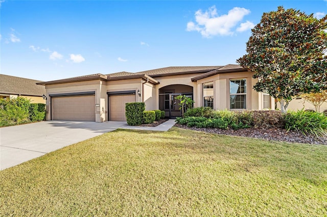 view of front of home featuring a front yard and a garage