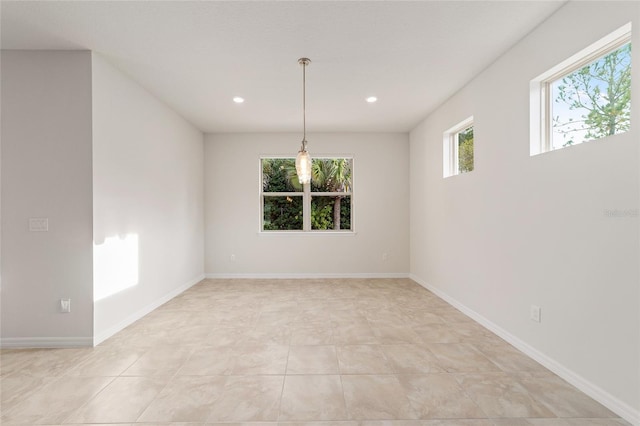 spare room featuring light tile patterned flooring