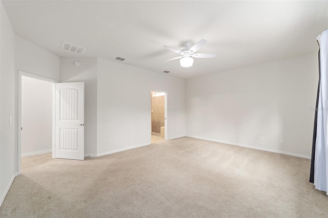 unfurnished bedroom featuring ceiling fan and light colored carpet