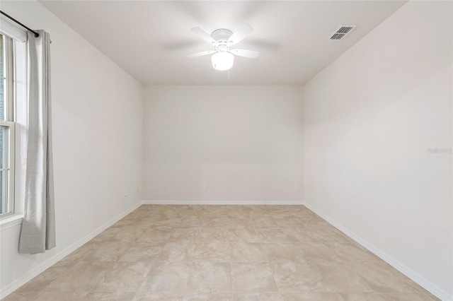 spare room with ceiling fan