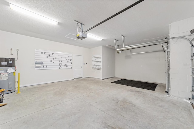 garage featuring water heater and a garage door opener