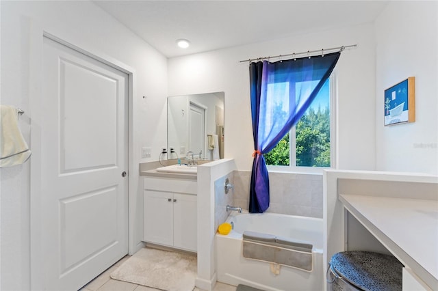 full bathroom with a garden tub, tile patterned flooring, and vanity