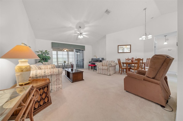 living room featuring ceiling fan with notable chandelier, light colored carpet, and lofted ceiling