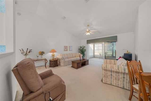 living room featuring ceiling fan, light colored carpet, and vaulted ceiling