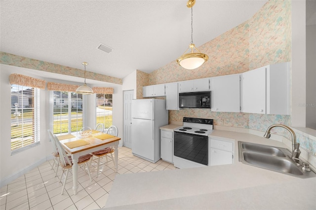 kitchen featuring white cabinetry, sink, hanging light fixtures, lofted ceiling, and white appliances