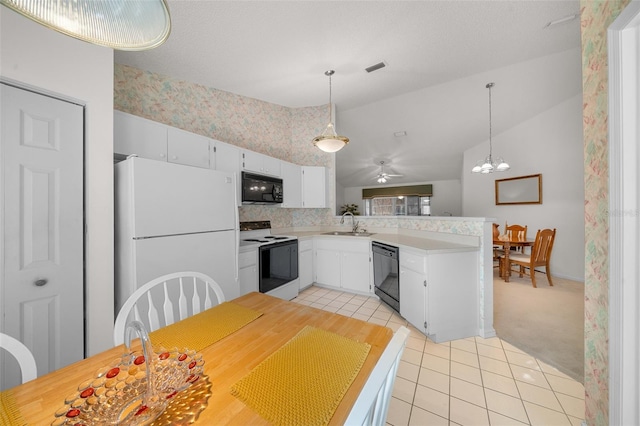 kitchen with ceiling fan with notable chandelier, white cabinets, black appliances, and decorative light fixtures