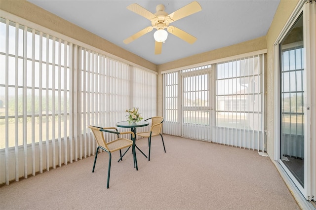 sunroom with plenty of natural light and ceiling fan