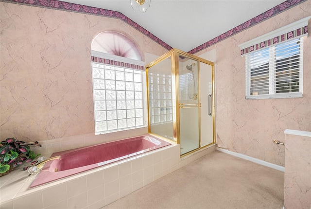 bathroom featuring separate shower and tub and lofted ceiling