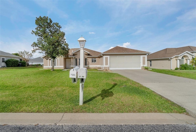 view of front facade with a garage and a front yard