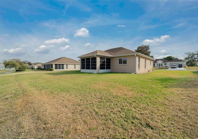 back of property with a lawn