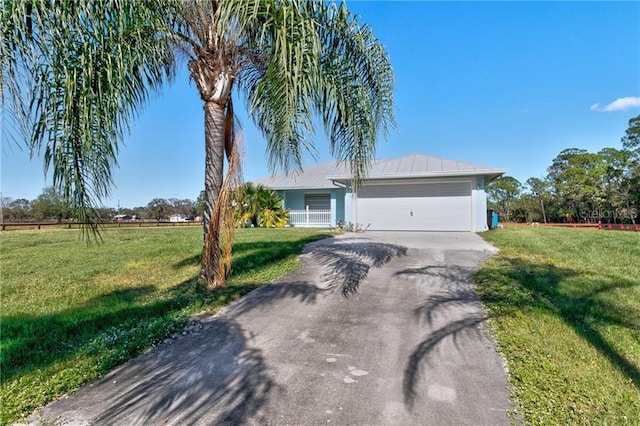 ranch-style home with a garage and a front lawn