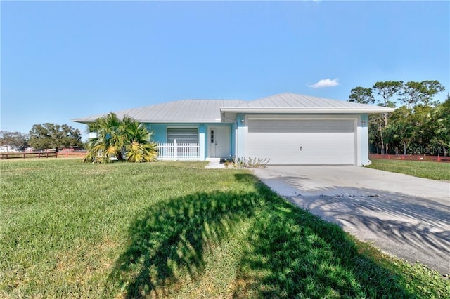 ranch-style home with a front yard and a garage