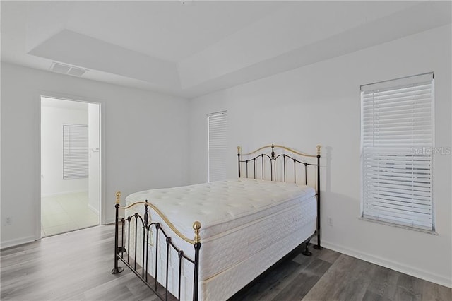 bedroom with wood-type flooring