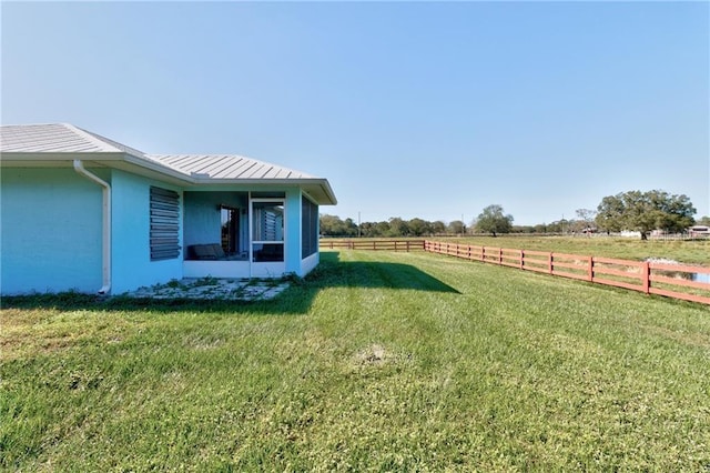 view of yard with a rural view