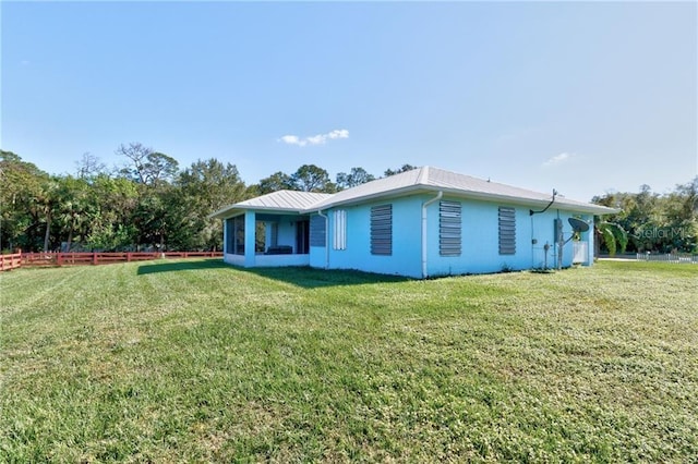 view of property exterior featuring a lawn