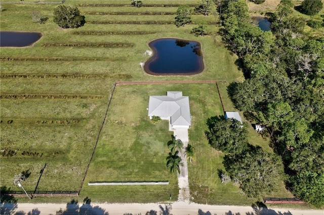 birds eye view of property with a rural view and a water view